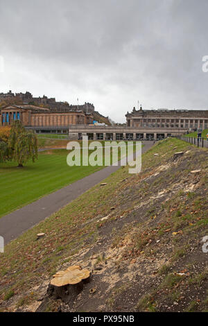 Edinburgh, Scotland, UK. 20th Oct, 2018.  Also, people can be seen relaxing in the gardens with some of the stumps of the recently felled 52 trees which some of the locals have branded 'An Absolute Disgrace', this is part of landscaping works and an extension at Scottish National Gallery backed by the Edinburgh council. Stock Photo