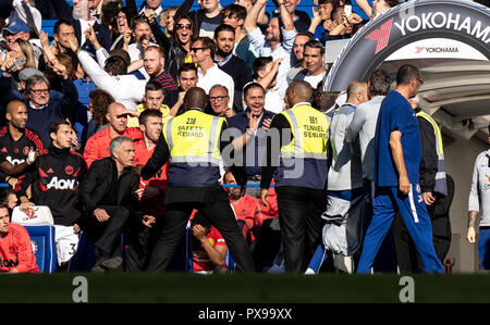 London, UK. 20th Oct, 2018. Jose Mourinho manager of Manchester United chases Marco Ianni assistant coach of Chelsea after he celebrated the Ross Barkley late equaliser in front of Mourinho during the Premier League match between Chelsea and Manchester United at Stamford Bridge, London, England on 20 October 2018. Photo by Liam McAvoy. Credit: UK Sports Pics Ltd/Alamy Live News Stock Photo