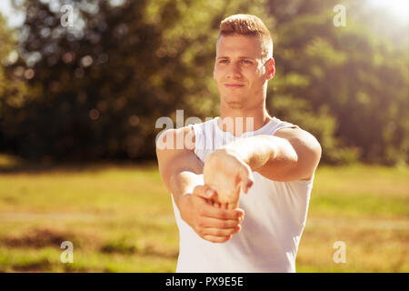 Young man exercising outdoor. Stock Photo
