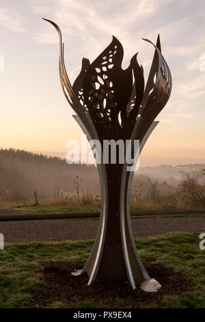 Miners memorial flame at sunrise, Gedling Country Park in Nottinghamshire, England UK Stock Photo