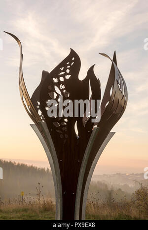 Miners memorial flame at sunrise, Gedling Country Park in Nottinghamshire, England UK Stock Photo