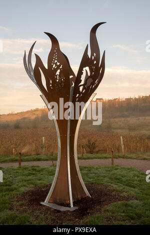 Miners memorial flame at sunrise, Gedling Country Park in Nottinghamshire, England UK Stock Photo