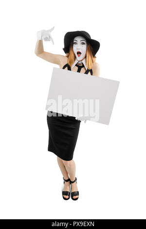 Your text here. Young woman holding a big empty card for your content. Vertical full body portrait of mime actress, isolated on white. Stock Photo
