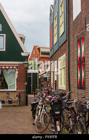 Volendam, Holland, on the Markermeer Lake, northeast of Amsterdam is known for its colorful wooden houses and the old fishing boats in its harbor. Stock Photo