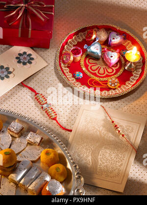 A STILL LIFE SYMBOLICALLY PORTRAYING THE FESTIVAL OF RAKSHA BANDHAN IN INDIA, ASIA Stock Photo