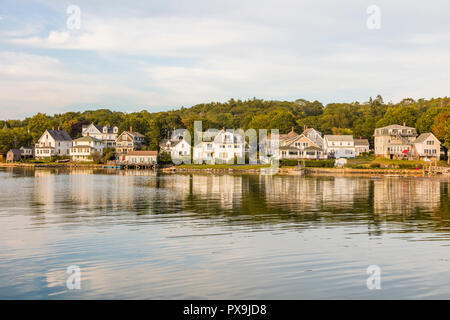 Houses on water in harbor area of Boothbay Harbor Maine in the United States Stock Photo