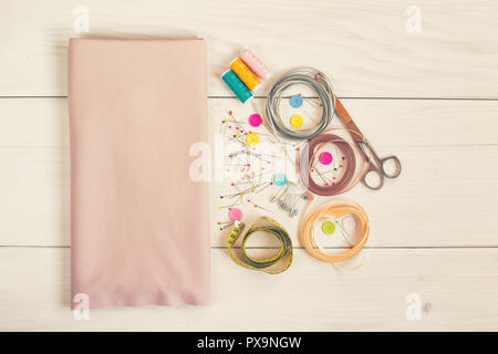 Sewing accessories on wooden table. Stock Photo