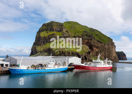 Commercial fishing boats in the harbor on Heimaey Island, in the Westman Island Group, Iceland. Stock Photo