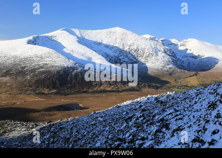 irelands second highest mountain covered in winter snow, wild atlantic way, county kerry, ireland Stock Photo