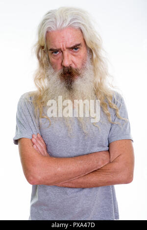 Studio shot of angry senior bearded man with arms crossed Stock Photo