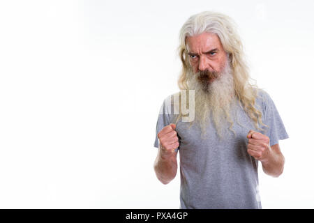 Studio shot of senior bearded man looking angry Stock Photo