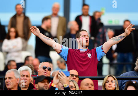 A West Ham United fan in the stands show his support during the Premier League match at London Stadium. Stock Photo