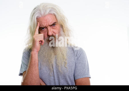Close up of senior bearded man thinking with finger on head Stock Photo