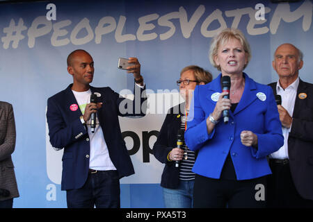 MP Chuka Umunna films on his mobile phone as MP Anna Soubry addresses Anti-Brexit campaigners at a rally after the People's Vote March for the Future in London, a march and rally in support of a second EU referendum. Stock Photo