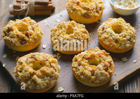 Apple Pie Donuts with Cinnamon Oatmeal Crumble, Homemade Freshly Baked Doughnuts Stock Photo