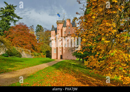 CRAIGIEVAR CASTLE ABERDEENSHIRE SCOTLAND PINK CASTLE TOWER AND COLOURFUL CHESTNUT TREE LEAVES IN AUTUMN Stock Photo