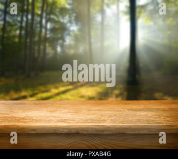 Empty table and defocused forest in background Stock Photo