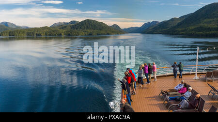 Cruise ship passengers aboard The Volendam, viewing beautiful scenery of the narrow and calm Principe Channel, part of the Inside passage route on the Stock Photo
