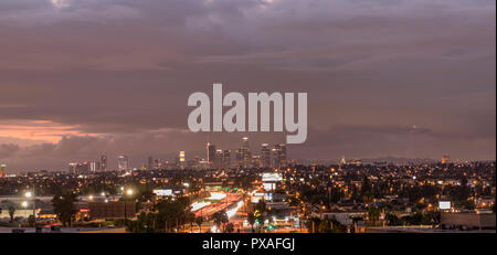 Sunset over Downtown Los Angeles and East LA on a stormy autumn evening, California, USA. Stock Photo