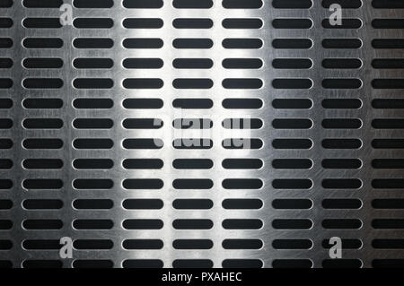 stainless steel grating with oblong holes, close-up Stock Photo