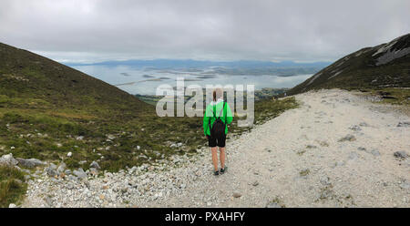 July 10,2017 - Westport, Ireland: The tourist on the road from the top of the mountain. View from Croagh Patrick mountain in Co. Mayo, Westport, West  Stock Photo