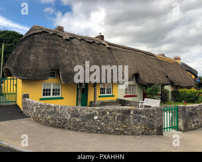 Adare, Ireland - 13 July,2018: Adare is a small village in County Limerick, Ireland,Architectural forms include the thatched cottages near the entranc Stock Photo