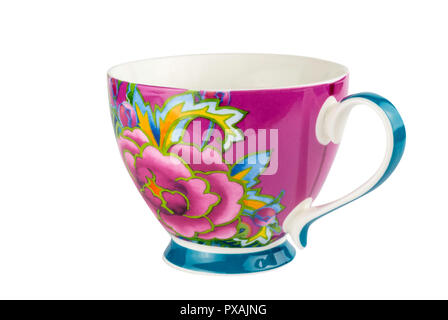Mug cup for tea or coffee brightly decorated in pink blue and yellow colours - hand painted oriental style cup isolated on white background Stock Photo