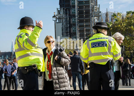 Police (Bobbies) on the beat in Parliament Square, Westminster, London, UK Stock Photo