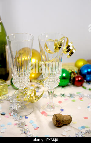 View of a table ready to celebrate Christmas where you can see tall glasses of champagne or cava, lucky grapes to celebrate the end of the year and so Stock Photo