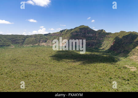 View across the main crater showing rim and forest below from Oloonongot Crater Point, Mount Longonot, Kenya Stock Photo