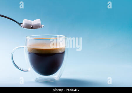 To cubes of sugar in spoon Stock Photo