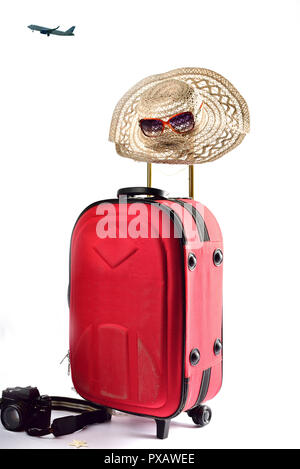 Suitcase and summer hat isolated on white background Suitcase and summer hat isolated on white background Stock Photo