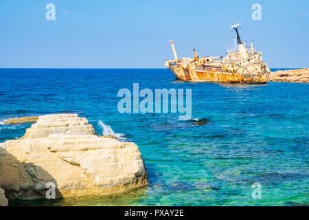 Abandoned rusty ship wreck EDRO III in Pegeia, Paphos, Cyprus. It is stranded on Peyia rocks at kantarkastoi sea caves, Coral Bay, Pafos, standing at  Stock Photo