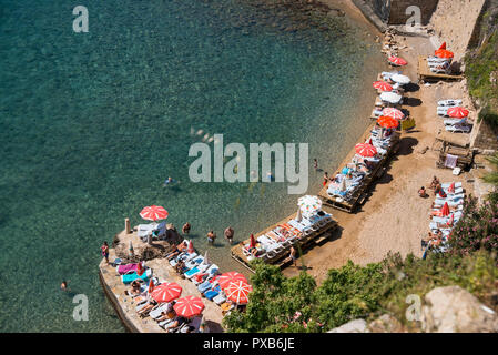 Antalya, Turkey - April 22, 2018: Small beach from top view with umbrellas, people and sunbeds. Stock Photo