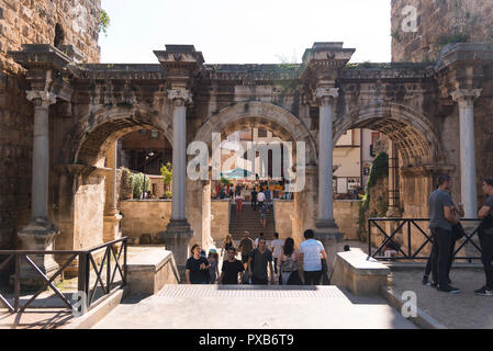 Antalya, Turkey - April 22, 2018:  Hadrian Door with crowded people Kaleici Antalya Turkey. Stock Photo