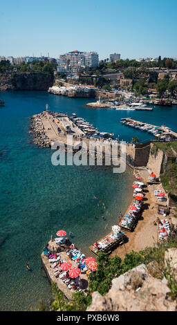 Antalya, Turkey - April 22, 2018: Small beach from top and panoramic shot of the rocks and buildings. Stock Photo