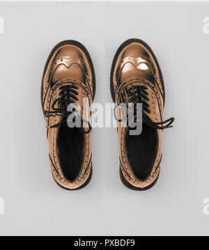 copper metallic women budapester shoes isolated on white grey background Stock Photo