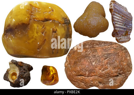 Natural rough amber stone on white isolated background. Stock Photo