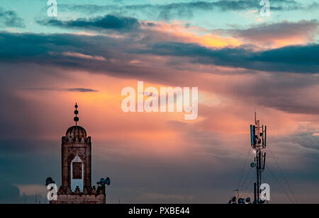 dramatic sky,  in sunset moment  in kenitra , shots from the roof . mosque , network ariel . Stock Photo