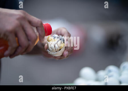 Balut is a fertilized duck egg incubated between 14-21 days then boiled or steamed.Considered a delicacy in the Philippines,commonly eaten as a snack  Stock Photo