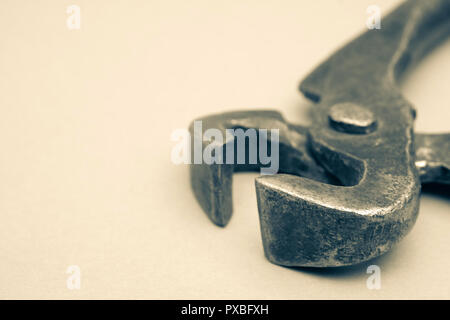 Tools for pulling nails - old metal pliers. Stock Photo