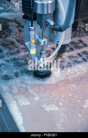 CNC water jet cutting machine modern industrial technology. Stock Photo