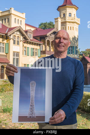 Storkow, Germany. 11th Oct, 2018. Rainer Opolka, entrepreneur and artist of the company Zweibrüder Kunst- und Kultur GmbH, stands in front of his castle Hubertushöhe and shows a design of an observation tower. Rainer Opolka wants to develop the area around Hubertushöhe Castle into an art and literature park. (to dpa-KORR 'From elitist castle hotel to art and literature park for all' from 21.10.2018) Credit: Patrick Pleul/ZB/dpa/Alamy Live News Stock Photo