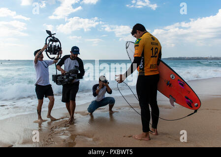 Gabriel Medina (BRA) is seen preparing to enter the water at Supertubos Beach, Peniche.  Brazilian surfer Italo Ferreira won the Portuguese stage of the World Surf League, MEO Rio Curl Pro, held in Peniche. Ferreira defeated frenchman Joan Duru in the final after beating compatriot Gabriel Medina in the semi-finals. Now all the attention goes to Havaii, the final step that will decide the next world surfing champion. Stock Photo