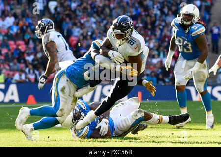 London, UK.  21 October 2018. Tight end Jonnu Smith (81) of the Titans is tackled. Tennessee Titans at Los Angeles Chargers NFL game at Wembley Stadium, the second of the NFL London 2018 games. Final score - Chargers 20 Titans 19.  Credit: Stephen Chung / Alamy Live News Stock Photo