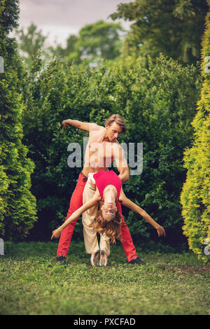 beautiful modern ballet couple dancing in summer outdoors Stock Photo