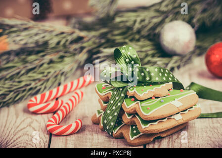Christmas composition - gingerbread cookie, anise and cinnamon on wooden table. Stock Photo