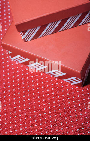 Christmas gift boxes on a red wrapping paper Stock Photo
