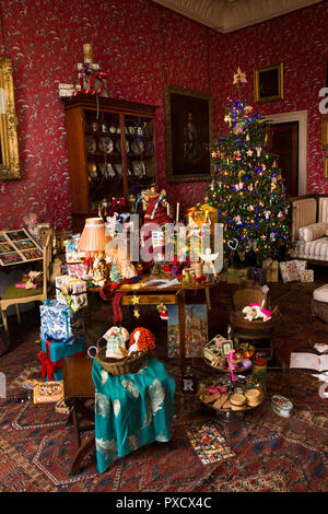 UK, England, Yorkshire, Castle Howard at Christmas, Dressing Room, traditional xmas presents and decorated tree Stock Photo