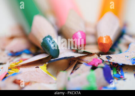 Closeup on sharpened colored pencils with shavings Stock Photo